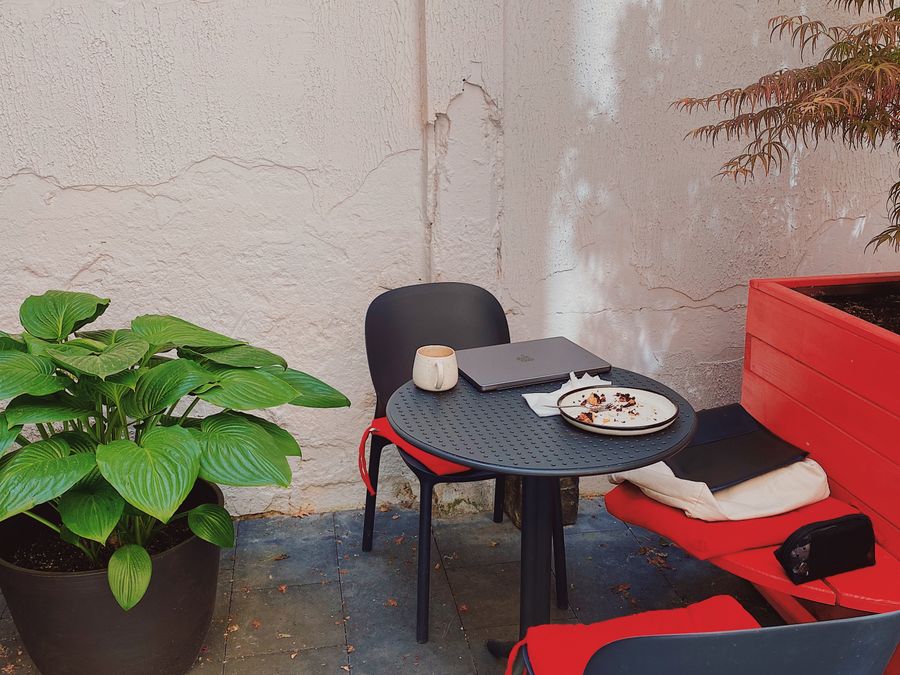 Outdoor patio seating with table and plants